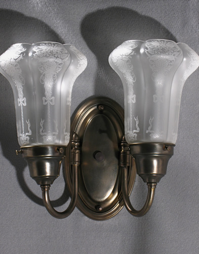 Pair of Double Arm Oval Back Sconces